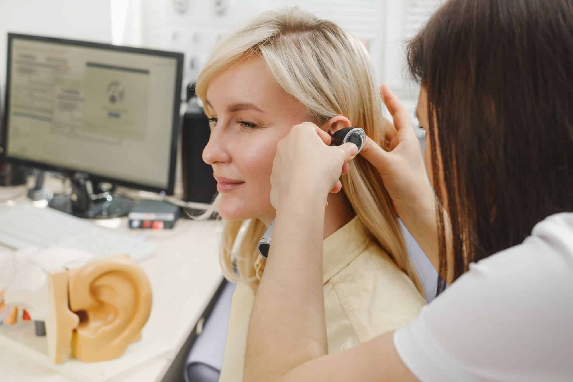 Woman having her hearing tested