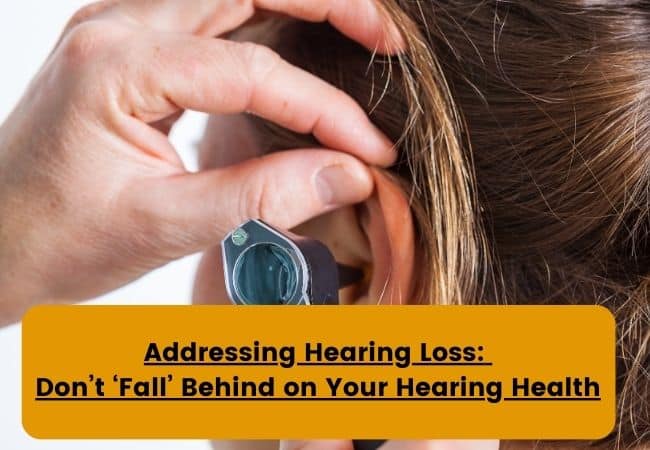 A woman has her ear examined using an otoscope