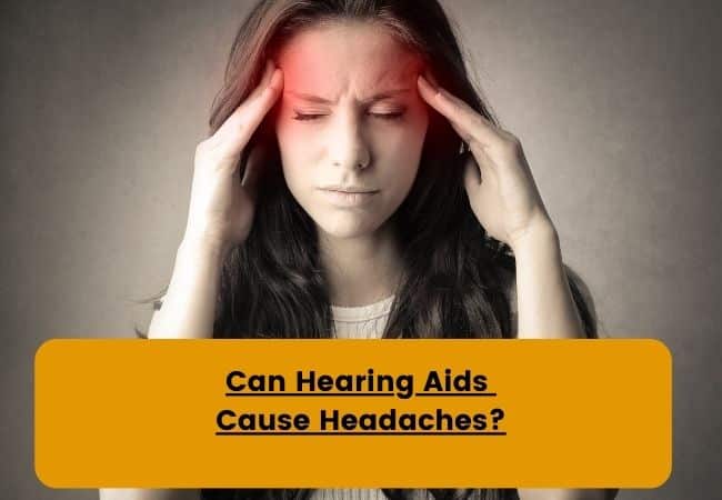 A woman holds her head as she experiences a headache