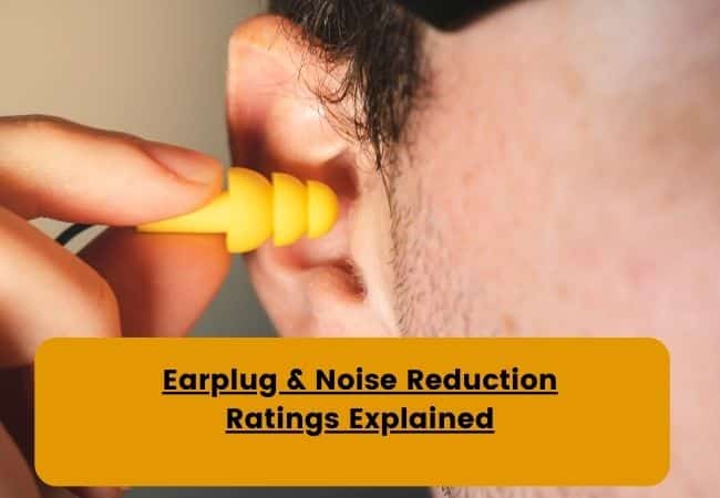 A Man inserts an earplug into his ear