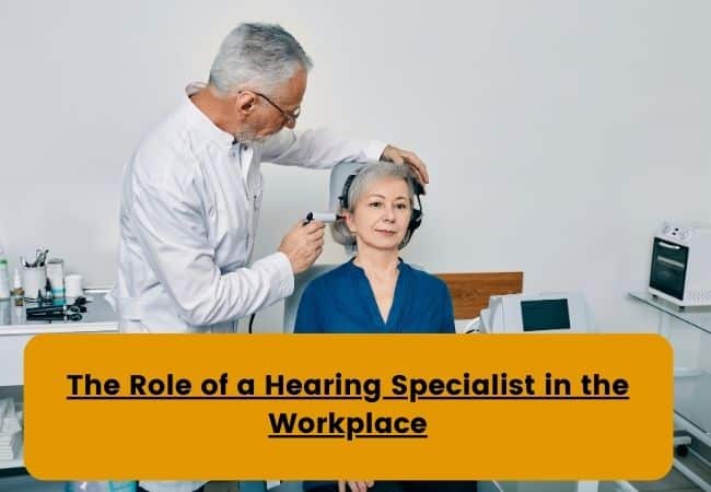 A hearing specialist examines a woman's ear using a video otoscope