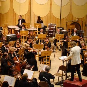 an orchestra and conductor