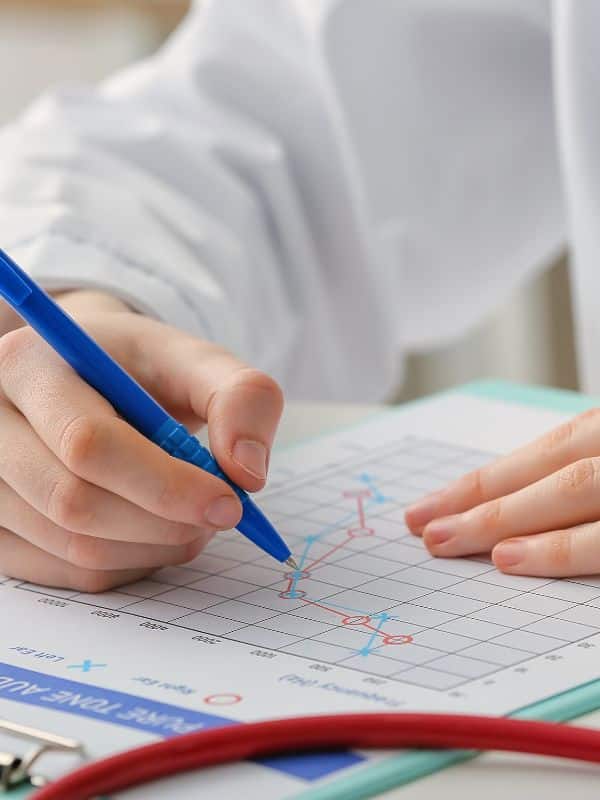 doctor marking an audiogram