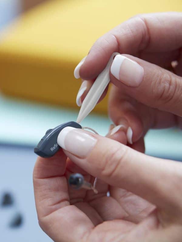 changing the filter on a hearing aid