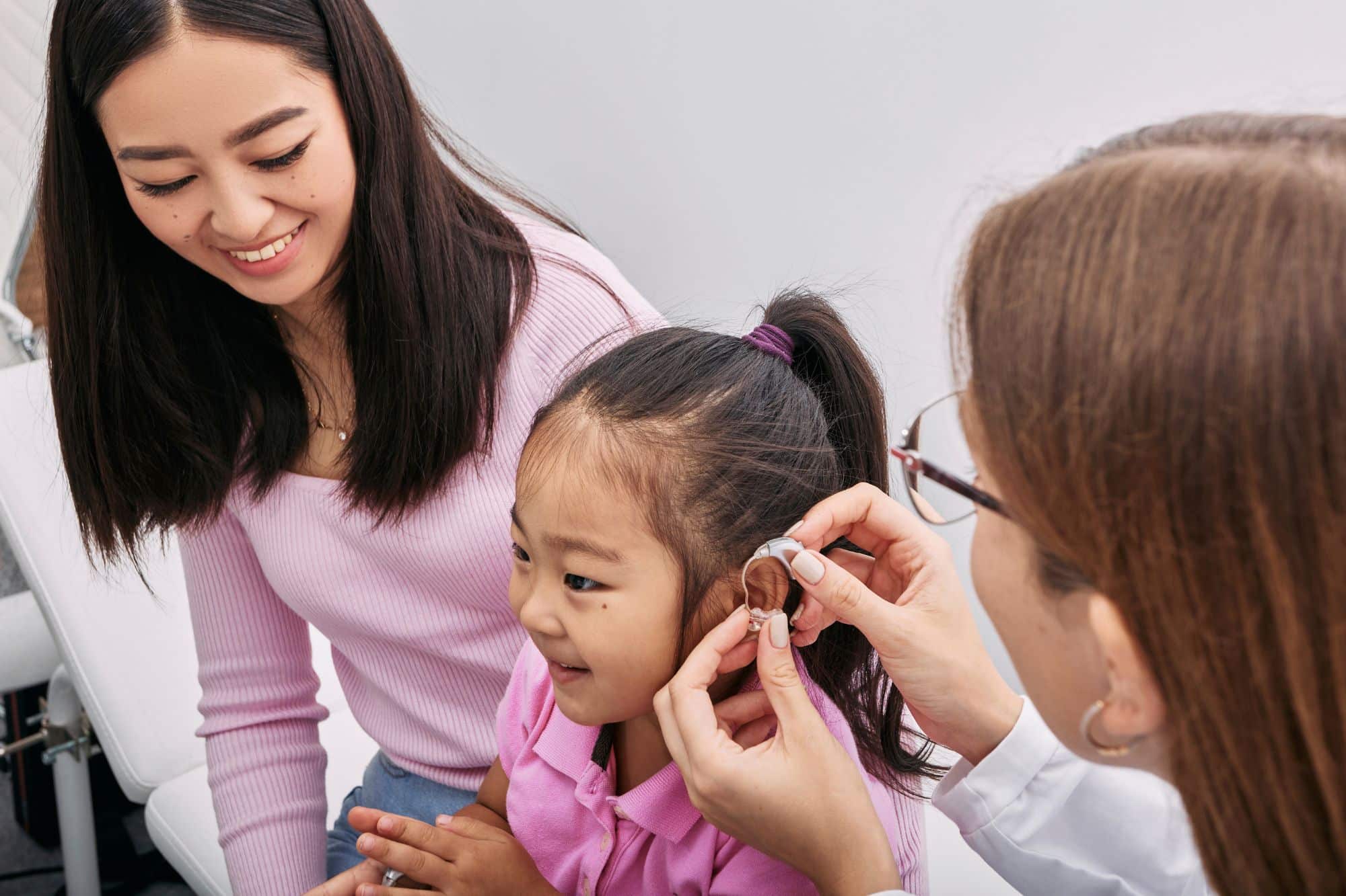 a child being fit for hearing aids