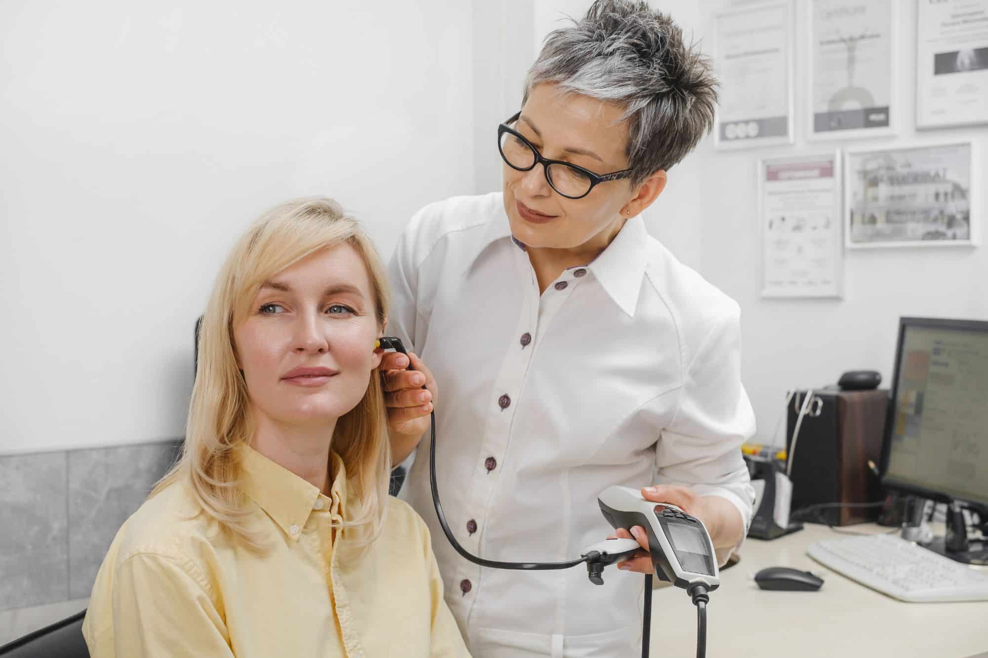 woman having her hearing tested