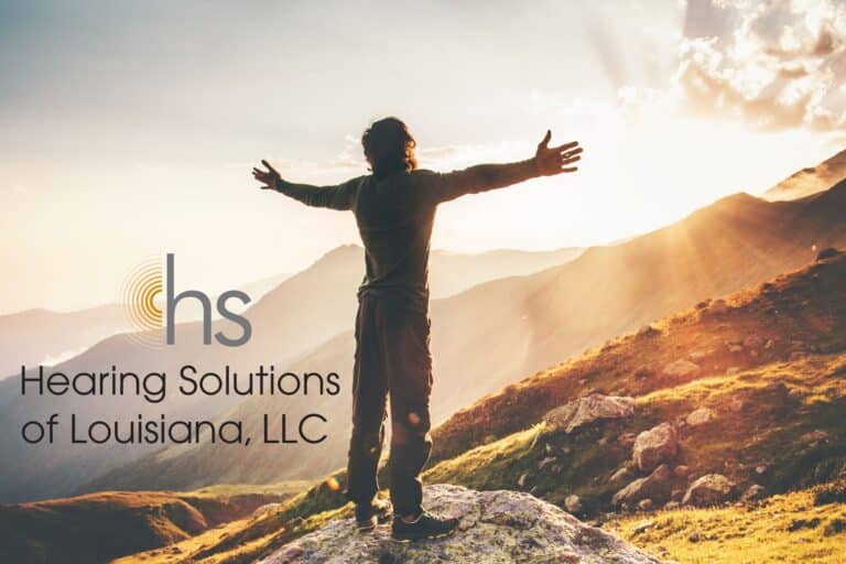 man greeting the sunrise on a mountaintop