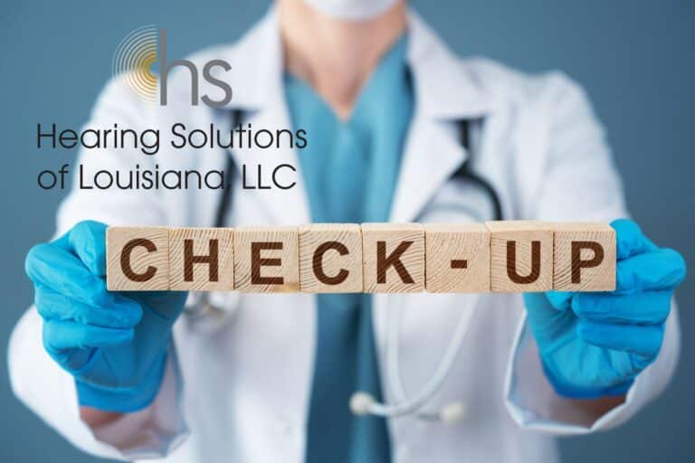 doctor holding wooden blocks that say check-up