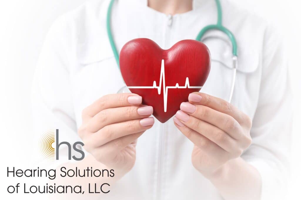 doctor holding a wooden heart