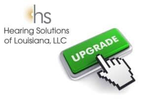 a finger pressing a green upgrade button